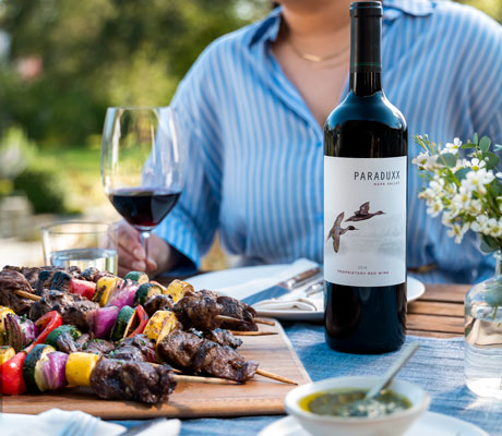 2019 Paraduxx Proprietary Napa Valley Red Wine on an outdoor table