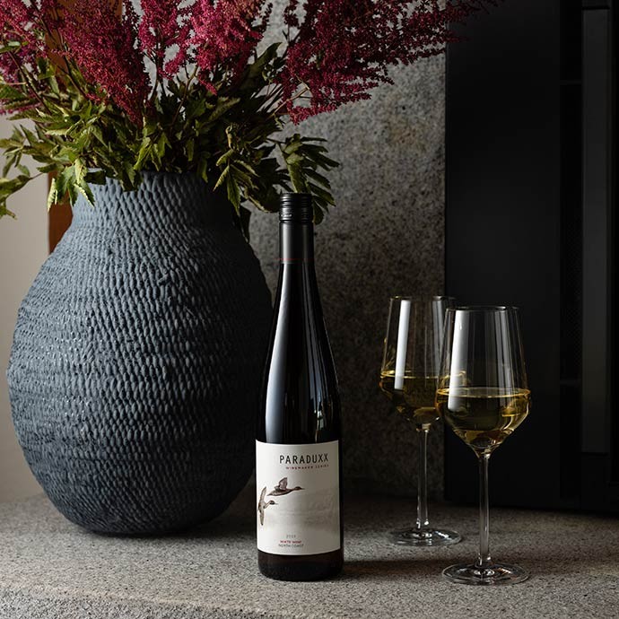 Paraduxx white wine bottle with two wine glasses